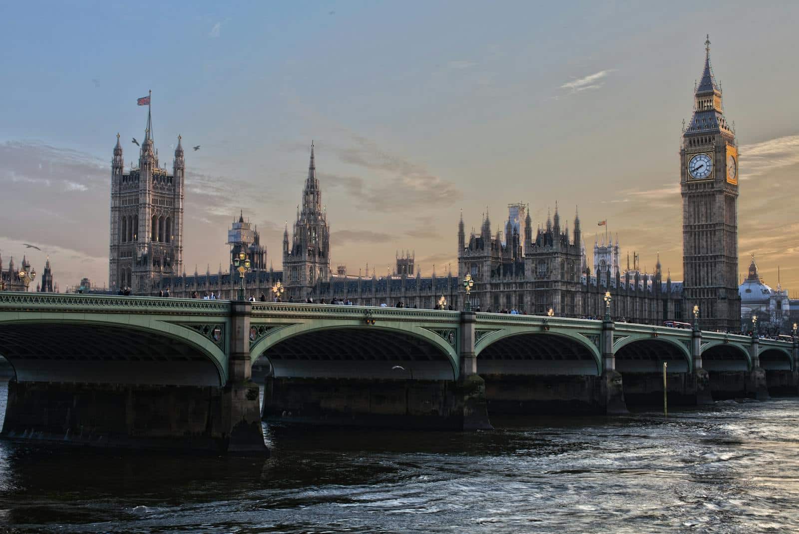 Stunning view of Big Ben and Westminster Bridge at sunset. Iconic London landmark.